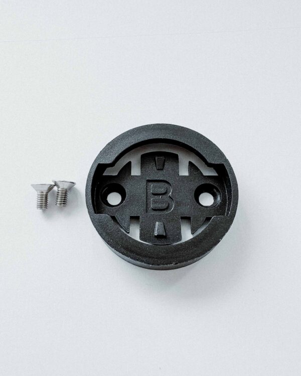 Spare part adapter for Bryton products with two M3x6mm countersunk screws.