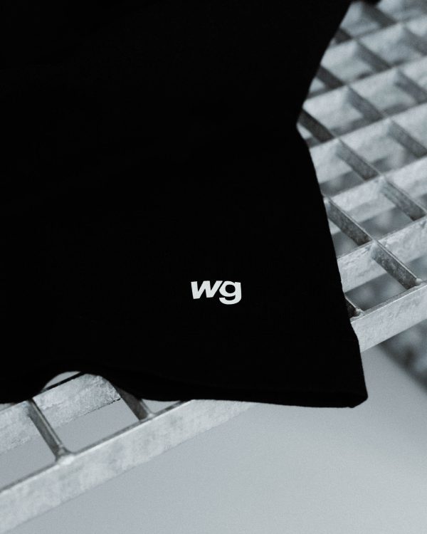 Back view of the black watts and grams logo t-shirt unisex with logo wg.